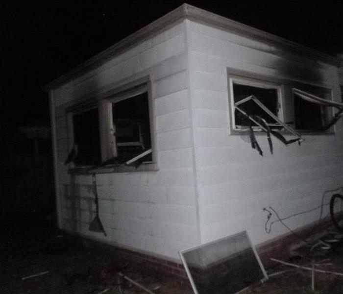 mobile home with burned out windows 