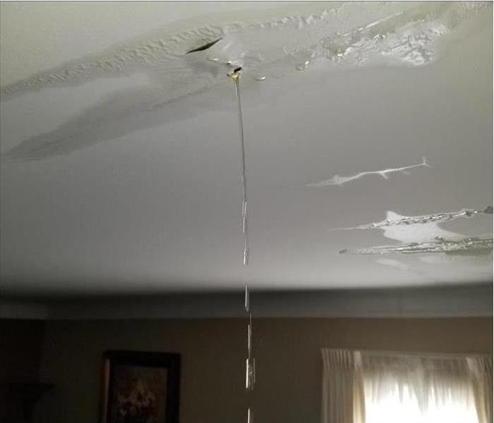 water pouring through ceiling