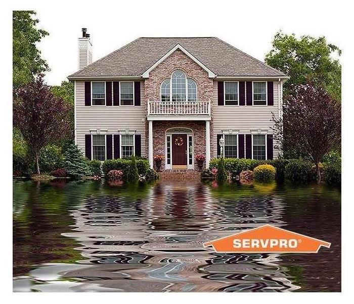 home in flooded street 