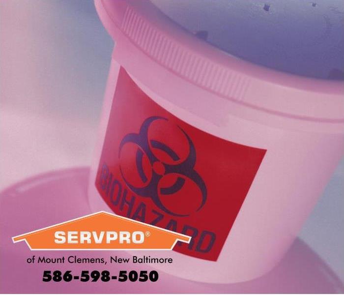 A biohazard sign is visible on a container.